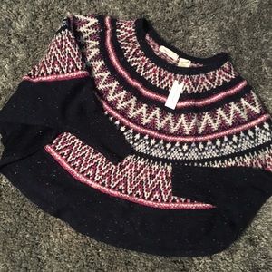 Anthropology sleeping on snow poncho